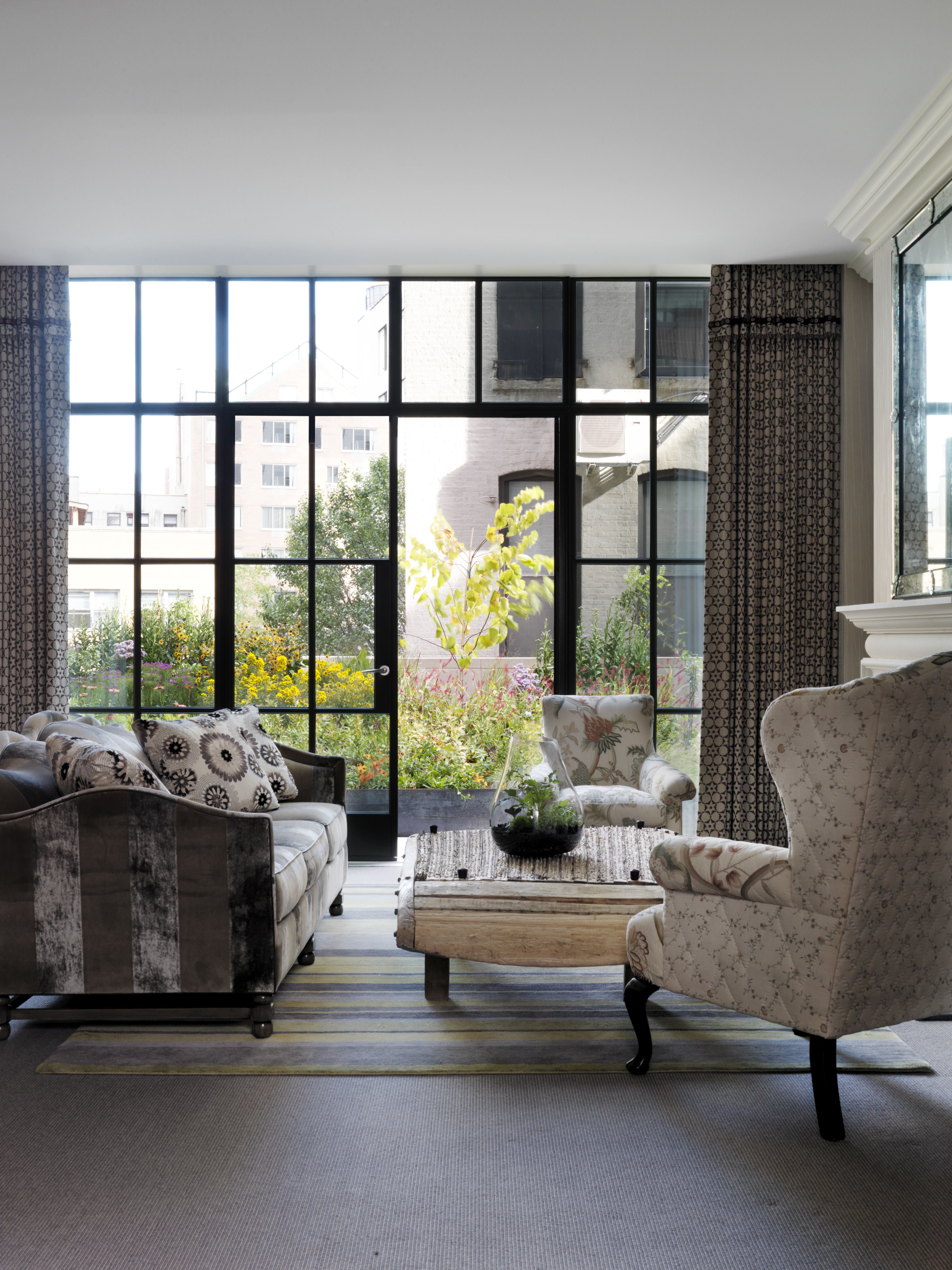 Meadow Suite with floor to ceiling windows framing a beautiful view of NYC.